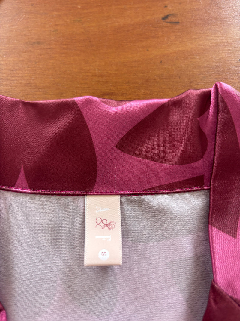 Corazones rosados short seda // Defectos en la prenda