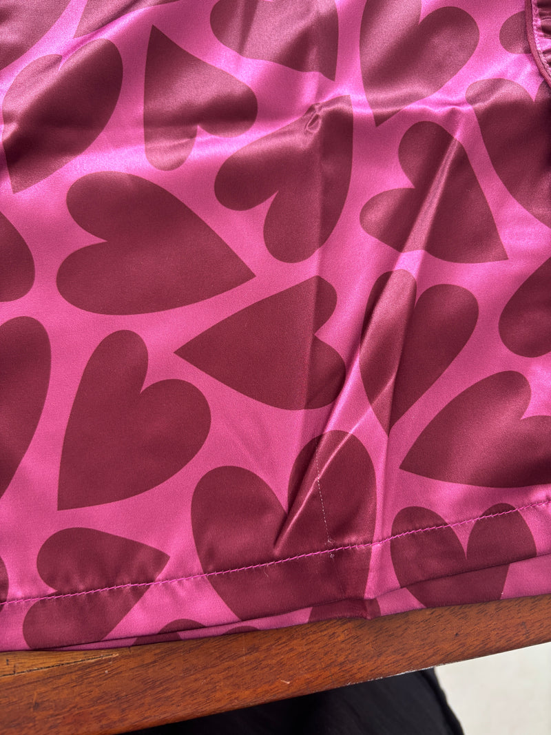 Corazones rosados short seda // Defectos en la prenda